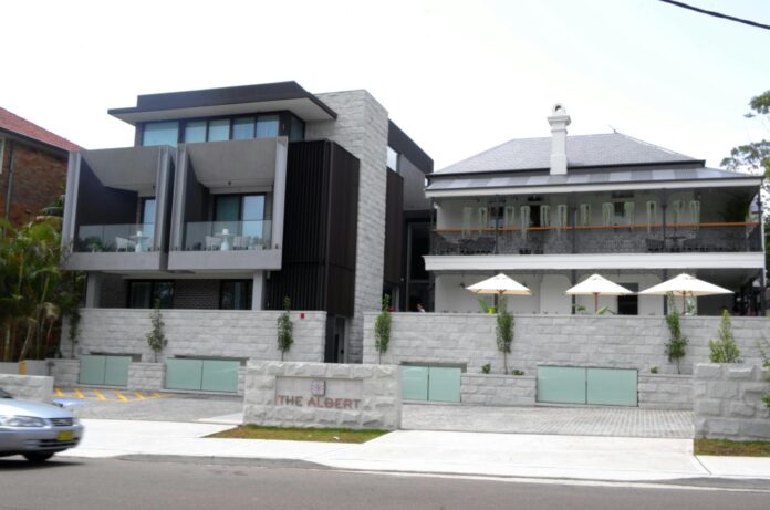 a building with a stone wall